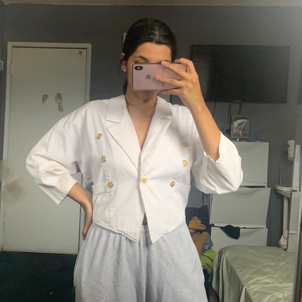 White jacket with gold buttons